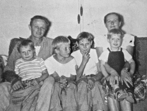 The family, approximately 1950. Dad and mom in back, with (L-R) Butch, Tom, Jim, and me.